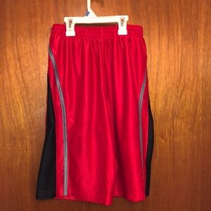 Red basketball shorts.